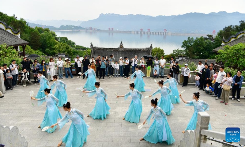 People watch a performance at the scenic area of the hometown of Qu Yuan, a patriotic poet of ancient China, in Zigui County of Yichang, central China's Hubei Province, May 3, 2026.(Photo by Wang Huifu/Xinhua)