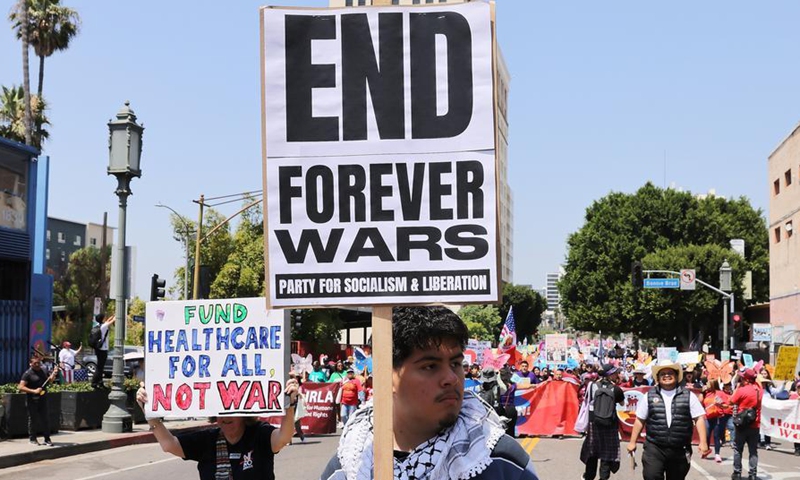 Demonstrators holding placards take part in a May Day rally in Los Angeles, California, the United States, on May 1, 2026. (Photo by Qiu Chen/Xinhua)