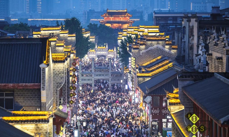 This photo taken on May 2, 2026 shows tourists visiting the Xiangyang ancient town in Xiangyang City, central China's Hubei Province.(Photo by Yang Dong/Xinhua)