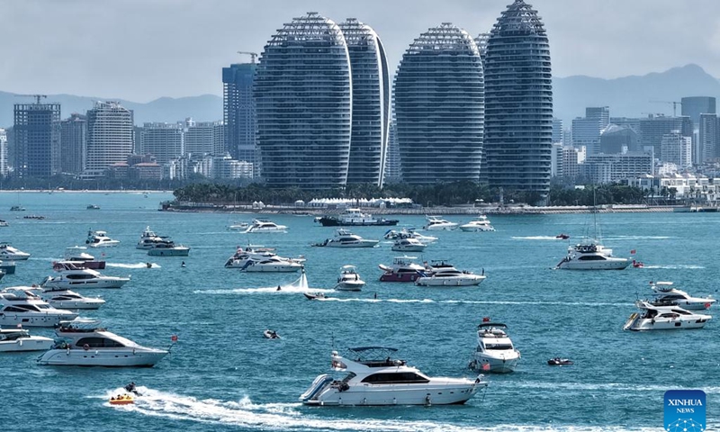 A drone photo taken on May 3, 2026 shows tourists taking yachts in Sanya, south China's Hainan Province.(Xinhua/Zhao Yingquan)