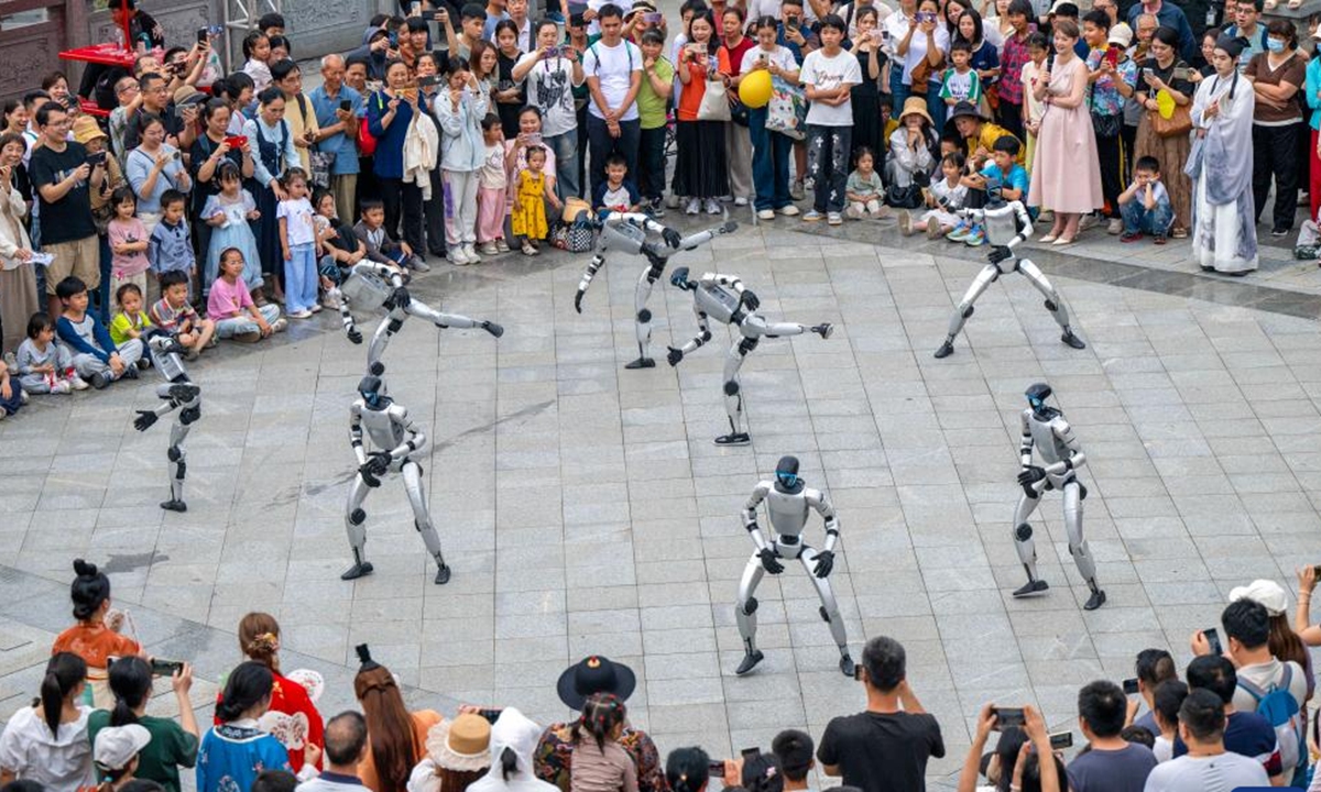 A drone photo taken on May 2, 2026 shows robots performing at a park in Wuzhou City, south China's Guangxi Zhuang Autonomous Region.
People across China stepped out to fully enjoy their leisure time during the ongoing May Day holiday. (Photo by He Huawen/Xinhua)