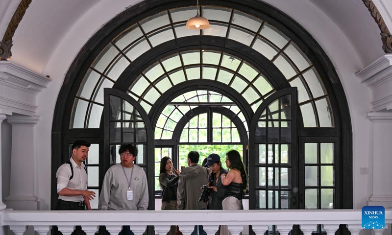 Entrepreneur Yin Tao (1st L) talks with one of his staff members at the former residence of Li Jifu in Heping District of north China's Tianjin, May 3, 2026. Photo: Xinhua