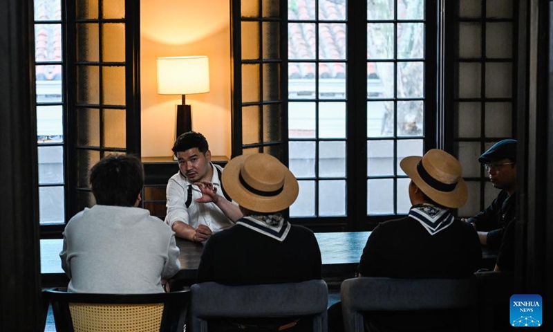 Entrepreneur Yin Tao (2nd L) holds a meeting with staff members at the former residence of Li Jifu in Heping District of north China's Tianjin, May 3, 2026. Photo: Xinhua