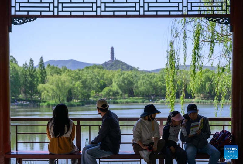 People visit a park in Beijing, capital of China, May 4, 2026. People across China stepped out to fully enjoy their leisure time during the ongoing May Day holiday. (Xinhua/Hu Jingwen)