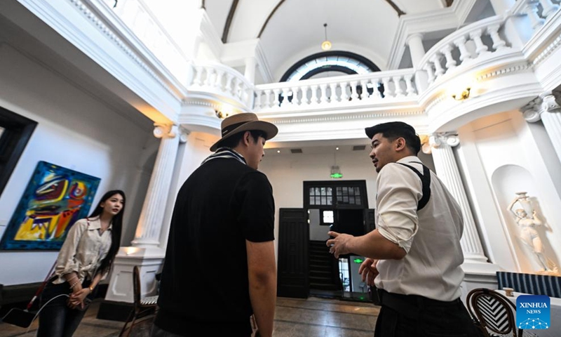 Entrepreneur Yin Tao (1st R) talks with one of his staff members at the former residence of Li Jifu in Heping District of north China's Tianjin, May 3, 2026. Photo: Xinhua