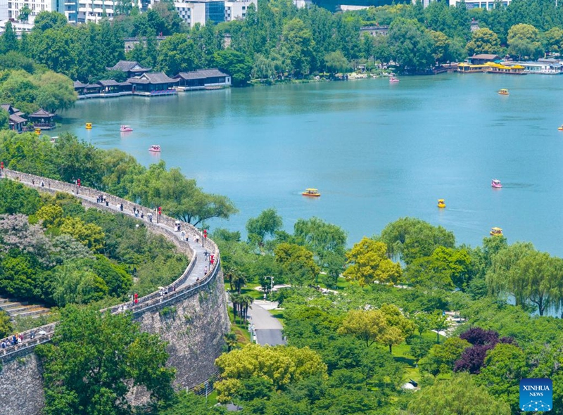 This aerial drone photo taken on May 4, 2026 shows people visiting the Xuanwu Lake in Nanjing, east China's Jiangsu Province. People across China stepped out to fully enjoy their leisure time during the ongoing May Day holiday. (Photo by Shi Jun/Xinhua)