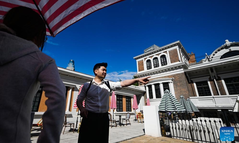 Entrepreneur Yin Tao briefs staff members on ticket-checking procedures at the entrance of the former residence of Li Jifu in Heping District of north China's Tianjin, May 3, 2026. Photo: Xinhua