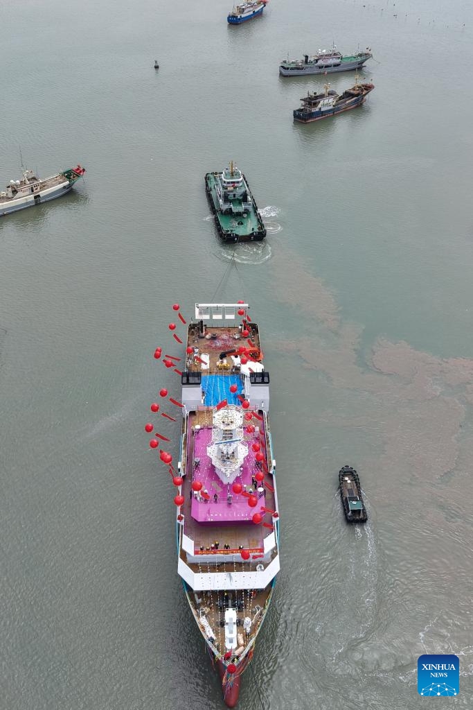 An aerial drone photo taken on May 5, 2026 shows China's first privately funded scientific research vessel, R/V Haiying Surveyor, in Wenling, east China's Zhejiang Province. R/V Haiying Surveyor was launched here on Tuesday. The vessel has a total length of 82 meters, a designed full load displacement of 3,500 tonnes, and a cruising range of 10,000 nautical miles. The vessel's backers are 37 fishermen from Wenling. (Photo: Xinhua)