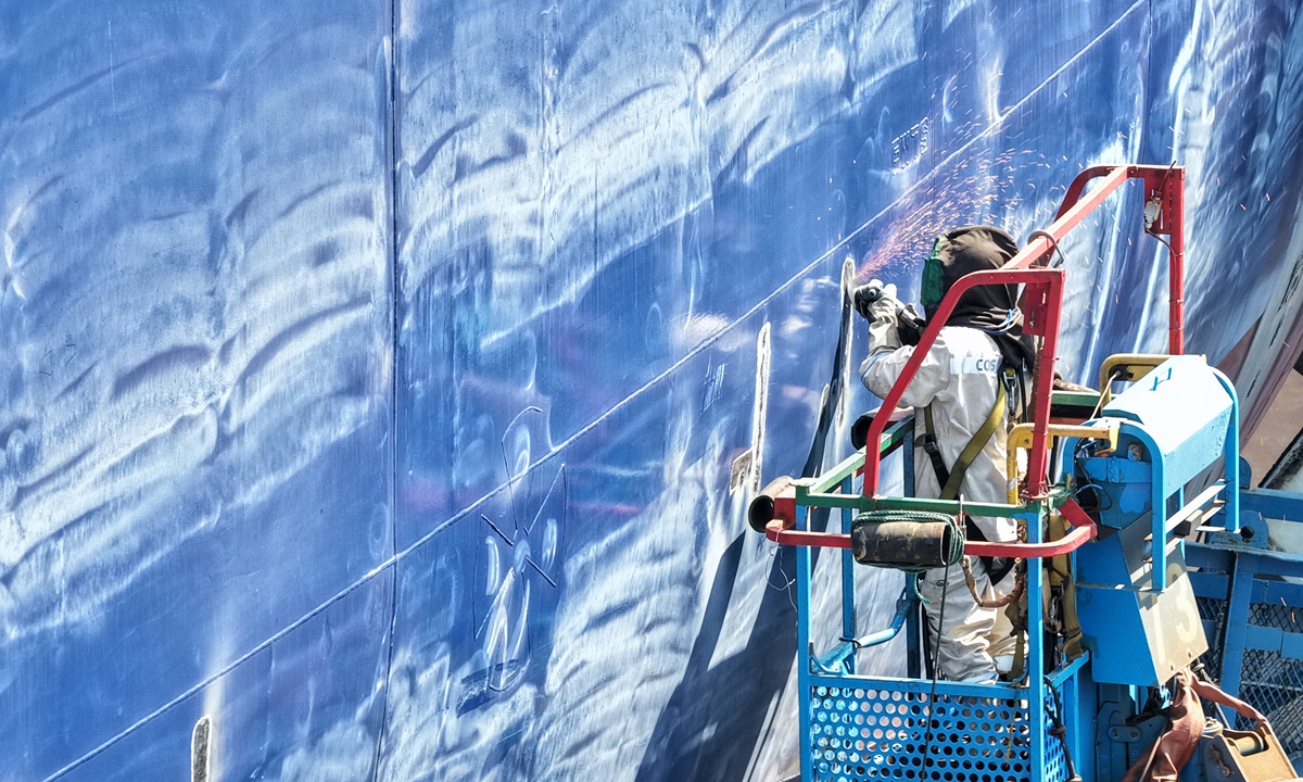 A worker builds a ship at a company in Yangzhou, East China's Jiangsu Province on May 6, 2026. The day was the first working day after the May Day holidays, and the workers were full of energy, busy with production and rushing to fulfill orders, creating a bustling and vibrant scene. Photo: VCG
