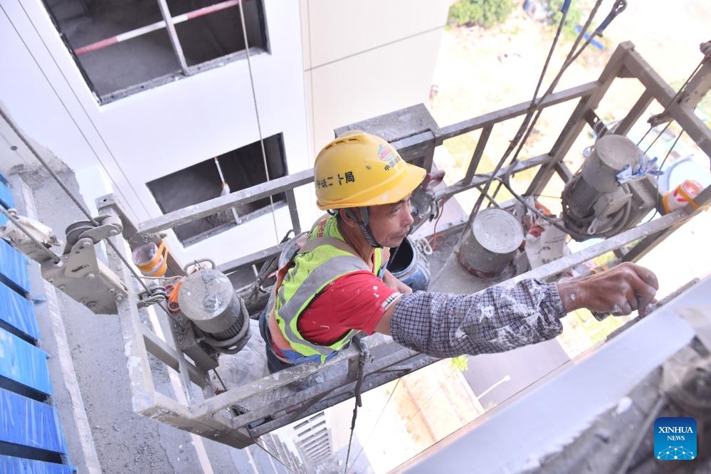 A worker from the China Railway 20th Bureau Group operates at the construction site of an urban village renovation project in Nanning, south China's Guangxi Zhuang Autonomous Region, May 5, 2026. Workers from the China Railway 20th Bureau Group stayed at their posts at multiple construction sites during the May Day holiday to ensure the high-quality and efficient delivery of these projects. (Photo: Xinhua)
