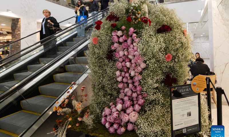 A floral mannequin is pictured during the 2026 Fleurs de Villes FLORA Bloor-Yorkville event in Toronto, Canada, on May 6, 2026. Showcasing more than 30 installations created by local floral designers, the event kicked off here on Wednesday and will last until Sunday. (Photo by Zou Zheng/Xinhua)