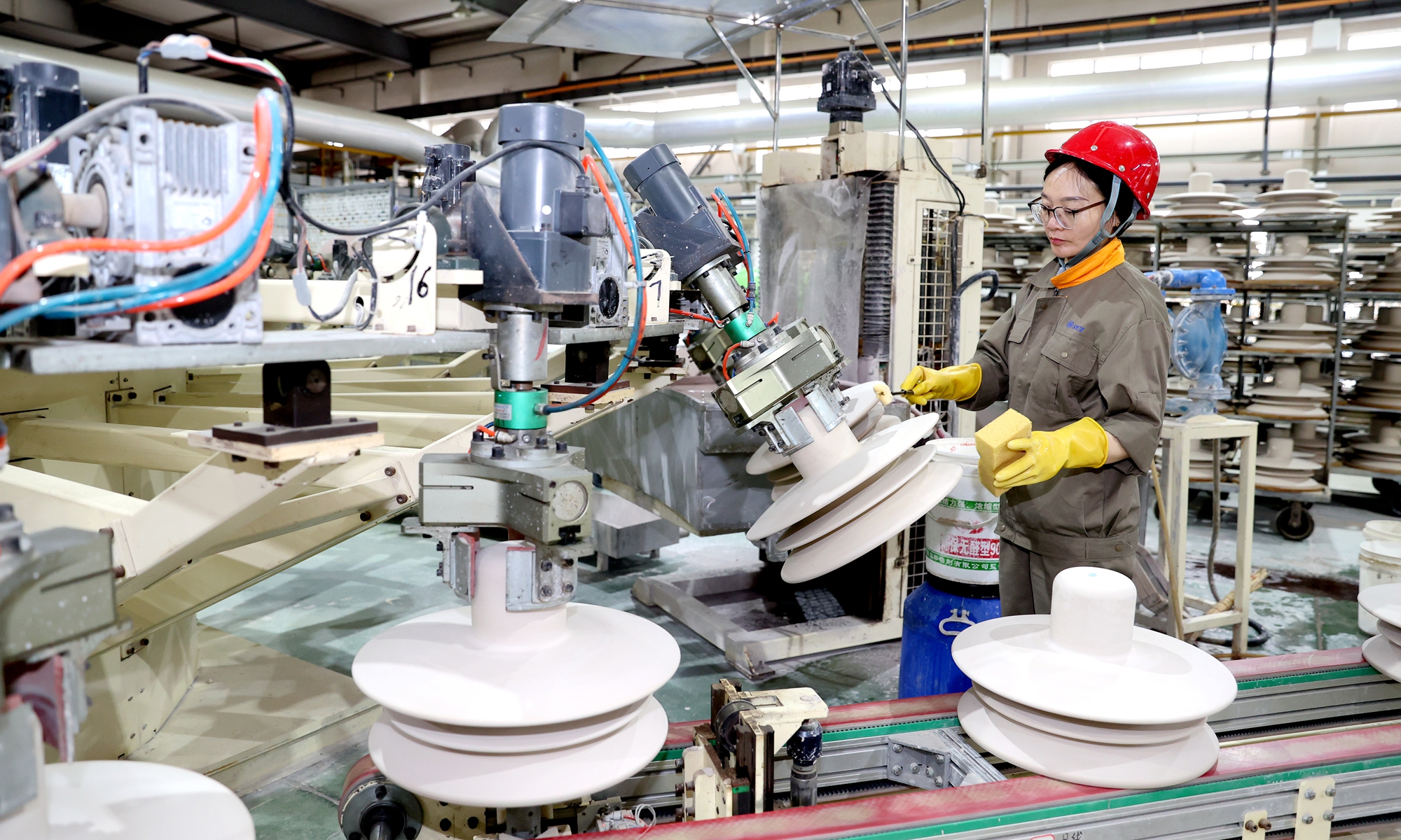 A worker fulfills export orders at Suzhou Porcelain Insulator Works Co in Suqian, East China's Jiangsu Province on May 7, 2026. The company specializes in manufacturing porcelain insulators, which are widely used in high-speed railways, urban rail systems, high-voltage overhead transmission lines, and power station electrical equipment. Its products are exported to Europe, North America, and Southeast Asia. Photo: VCG