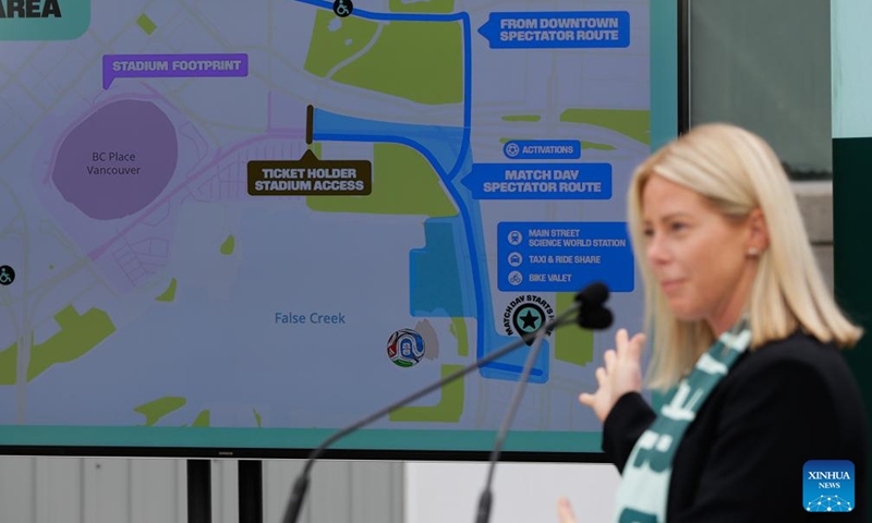 A presenter highlights a detailed map showing spectator routes and transportation options for FIFA World Cup 2026 match day at BC Place Stadium during a media event in Vancouver, British Columbia, Canada, on May 6, 2026. The City of Vancouver on Wednesday launched its FIFA World Cup 2026 Know Before You Go campaign to help visitors navigate where to go and how to get there, including accessing matches, events and other destinations during the tournament. (Photo by Liang Sen/Xinhua)

