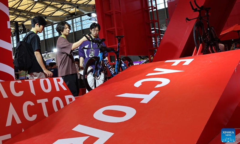 Visitors view a bicycle at the 2026 China International Bicycle Fair in east China's Shanghai, May 6, 2026. The four-day 2026 China International Bicycle Fair kicked off at Shanghai New International Expo Centre on Tuesday. (Xinhua/Fang Zhe)

