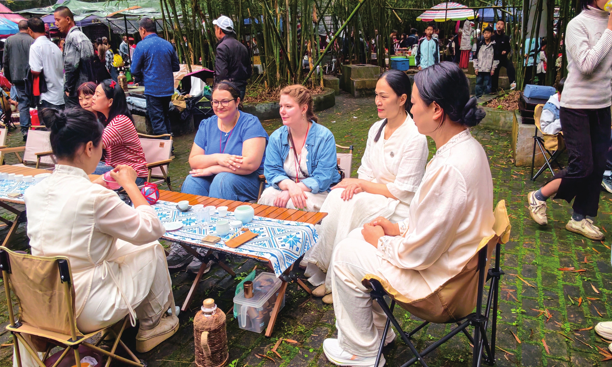 Foreign tourists experience Chinese tea culture in Zhangkou village, South China's Guangxi Zhuang Autonomous Region, on April 17, 2026. 