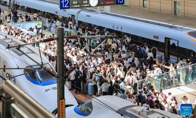This photo taken on May 5, 2026 shows passengers at the platform of Nanjing Railway Station in Nanjing, east China's Jiangsu Province. China logged around 1.52 billion inter-regional passenger trips during the just-concluded five-day May Day holiday, a 3.49 percent increase over the same period last year, the Ministry of Transport said on Wednesday. (Photo by Su Yang/Xinhua)

