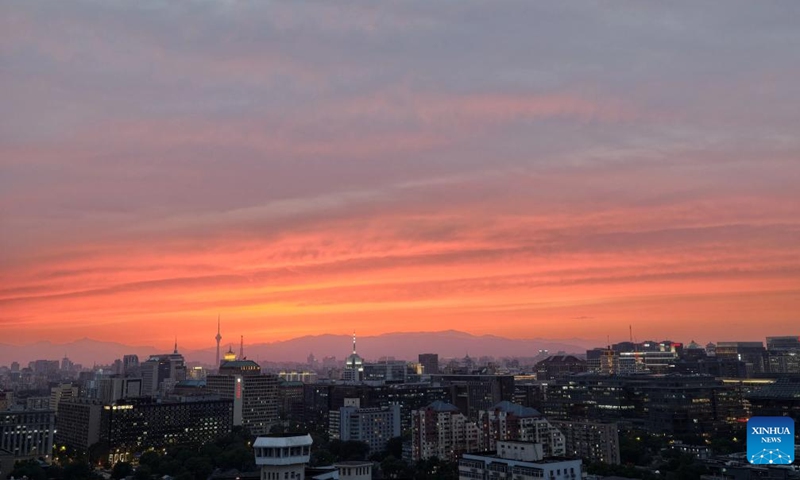 This photo taken on May 6, 2026 shows a view of the sunset glow in Beijing, capital of China. (Xinhua/Xing Guangli)