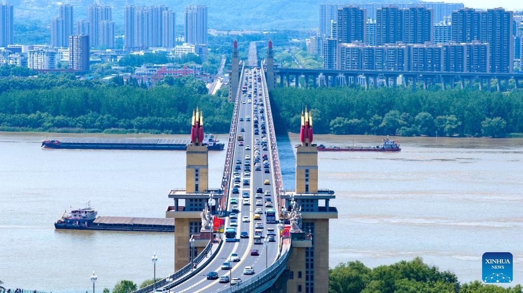 A drone photo taken on May 1, 2026 shows the traffic flow on the Nanjing Yangtze River Bridge in Nanjing, east China's Jiangsu Province. China logged around 1.52 billion inter-regional passenger trips during the just-concluded five-day May Day holiday, a 3.49 percent increase over the same period last year, the Ministry of Transport said on Wednesday. (Photo by Yang Suping/Xinhua)

