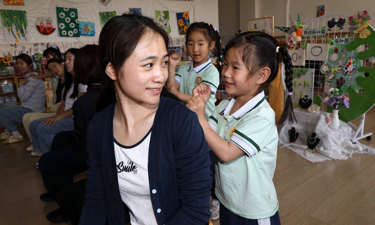 Children give their mothers a massage during a Mother's Day event at a kindergarten in Binzhou, East China's Shandong Province on May 10, 2026. Photo: VCG