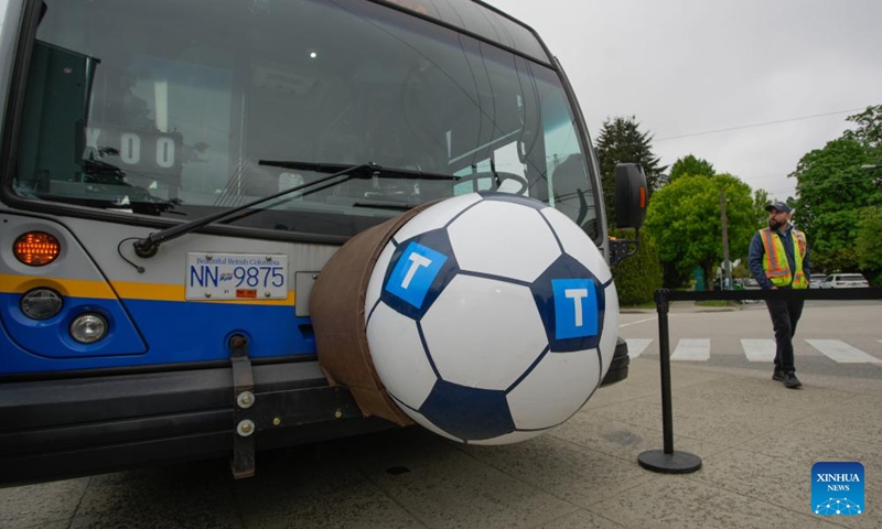 A bus decorated with a giant soccer ball prepares for transit service to the FIFA World Cup 2026 venues and Fan Festival in Vancouver, British Columbia, Canada, on May 6, 2026. The City of Vancouver on Wednesday launched its FIFA World Cup 2026 Know Before You Go campaign to help visitors navigate where to go and how to get there, including accessing matches, events and other destinations during the tournament. (Photo by Liang Sen/Xinhua)

