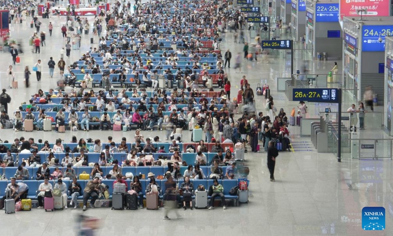 Passengers wait for their trains at Guiyang North Railway Station in Guiyang, southwest China's Guizhou Province, May 5, 2026. China logged around 1.52 billion inter-regional passenger trips during the just-concluded five-day May Day holiday, a 3.49 percent increase over the same period last year, the Ministry of Transport said on Wednesday.
