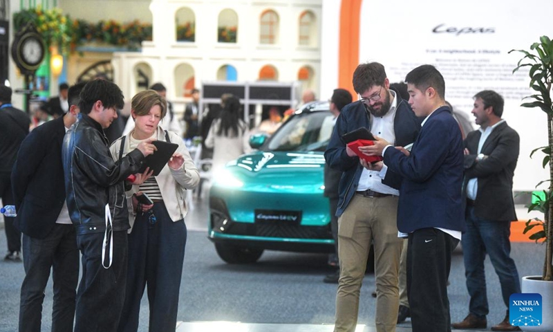 Foreign guests learn about vehicles of Chinese automaker Chery at the 2026 Chery International Business Summit in Wuhu, east China's Anhui Province, April 28, 2026. (Xinhua)

