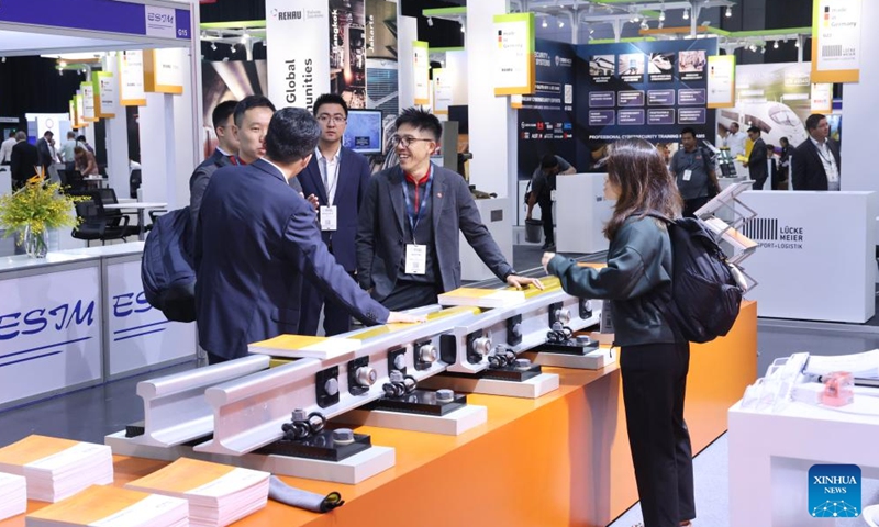 Visitors talk at the booth of China Railway Shanhaiguan Bridge Group (CRSBG) at the Asia Pacific Rail 2026 in Bangkok, Thailand, May 6, 2026. (Xinhua/Sun Weitong)