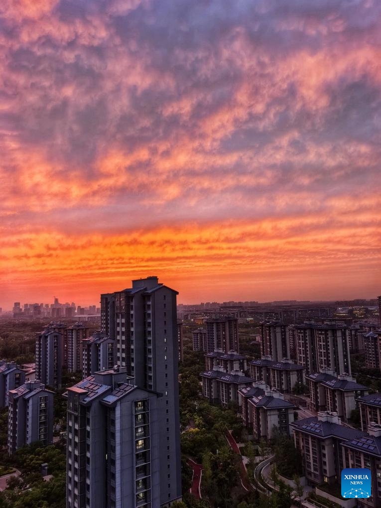 This photo taken on May 6, 2026 shows a view of the sunset glow in Beijing, capital of China. (Photo by Wang Tiezhong/Xinhua)