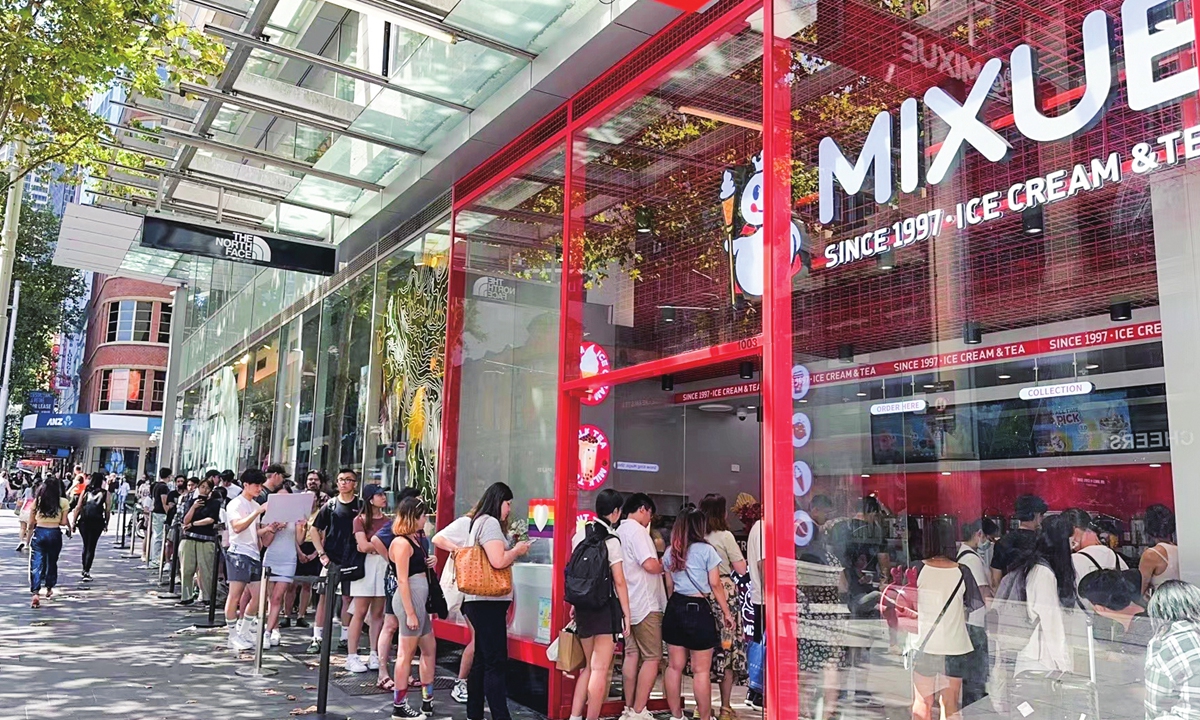 Customers line up outside a store of Chinese new-style tea brand Mixue in Australia.