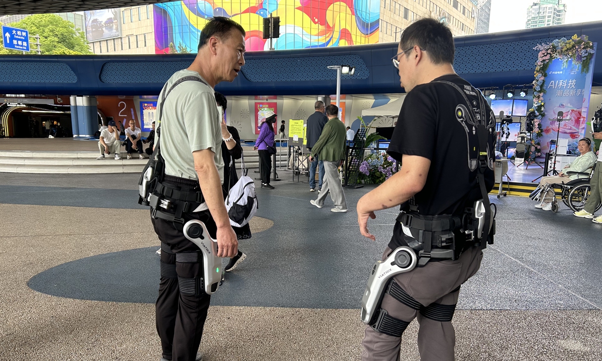 A visitor tries out an exoskeleton robot at Wujiaochang Square in Yangpu District, Shanghai, during the ongoing 7th Shanghai May 5 Shopping Festival on May 7, 2026. Photo: Qi Xijia/GT