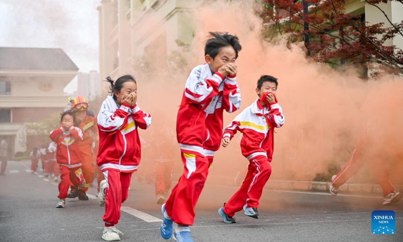 Students take part in an emergency evacuation drill under the guidance of firefighters in Guiyang, southwest China's Guizhou Province, May 11, 2026. A variety of activities were held across the country marking the upcoming National Disaster Prevention and Reduction Day. (Photo by Yuan Fuhong/Xinhua)