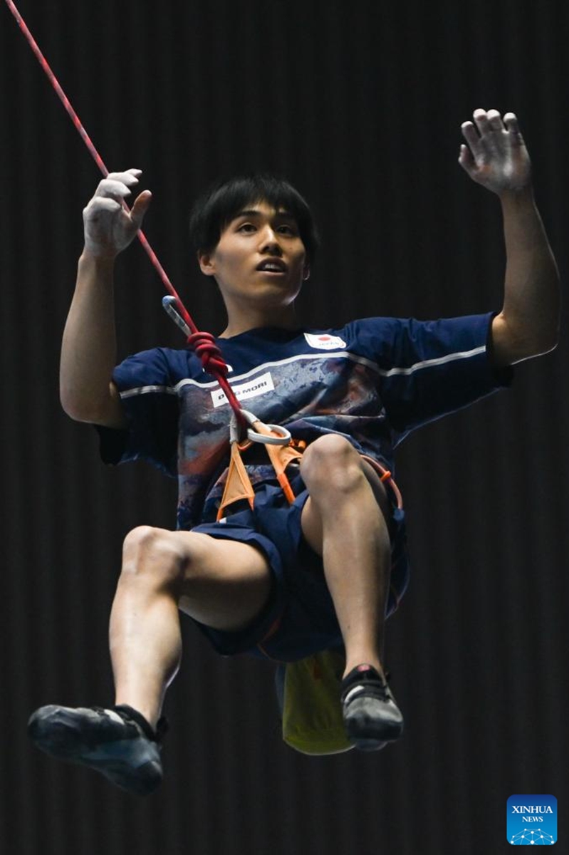 Suzuki Neo of Japan celebrates after the men's lead final at World Climbing Series Wujiang 2026 in Suzhou, east China's Jiangsu Province, May 9, 2026. (Photo by Wang Xuzhong/Xinhua)