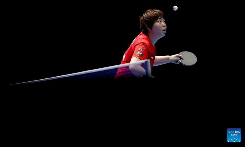 Kuai Man of China serves in the singles match against Andreea Dragoman of Romania during the women's teams semifinal match between China and Romania at the ITTF World Team Table Tennis Championships Finals in London, Britain, on May 9, 2026. (Xinhua/Li Ying)