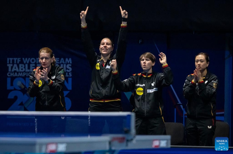 Team Germany cheer for Han Ying of Germany as she competes in the singles match against Harimoto Miwa of Japan during the women's teams semifinal match between Germany and Japan at the ITTF World Team Table Tennis Championships Finals in London, Britain, on May 9, 2026. (Photo by Stephen Chung/Xinhua)