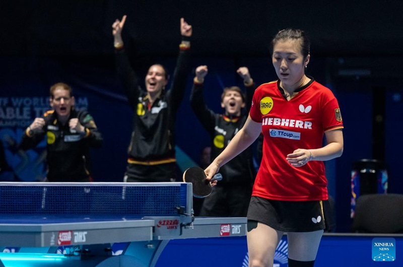 Team Germany cheer for Han Ying of Germany as she competes in the singles match against Harimoto Miwa of Japan during the women's teams semifinal match between Germany and Japan at the ITTF World Team Table Tennis Championships Finals in London, Britain, on May 9, 2026. (Photo by Stephen Chung/Xinhua)