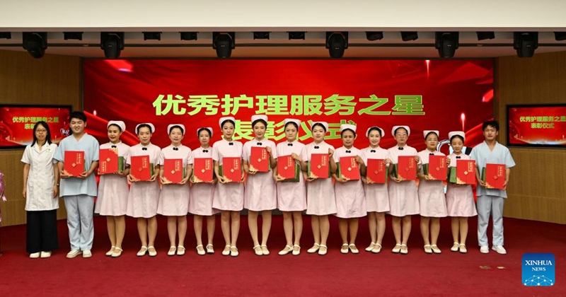 Nurse representatives receive their awards during International Nurses Day celebrations at Beijing Massage Hospital in Beijing, capital of China, May 9, 2026. Beijing Massage Hospital held a series of events on Saturday to celebrate the upcoming International Nurses Day, which falls on May 12. (Xinhua/Chen Shuo)