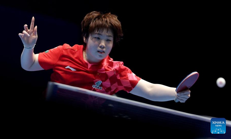 Kuai Man of China hits a return in the singles match against Andreea Dragoman of Romania during the women's teams semifinal match between China and Romania at the ITTF World Team Table Tennis Championships Finals in London, Britain, on May 9, 2026. (Xinhua/Li Ying)