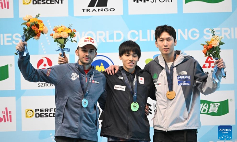 Gold medalist Suzuki Neo (C) of Japan, silver medalist Alberto Gines Lopez (L) of Spain and Lee Dohyun of South Korea pose during the awarding ceremony after the men's lead final at World Climbing Series Wujiang 2026 in Suzhou, east China's Jiangsu Province, May 9, 2026. (Photo by Wang Xuzhong/Xinhua)