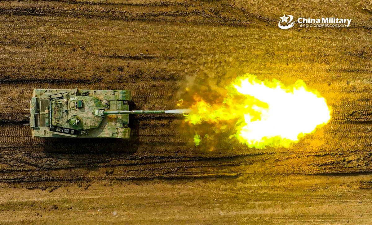 A Type-96 main battle tank (MBT) attached to a brigade under the Chinese PLA 71st Group Army opens fire at the mock target during a live-fire shooting training exercise on April 25, 2026. (Photo: eng.chinamil.com.cn)