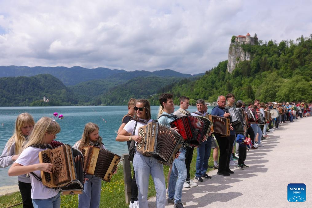Participants play the accordion during the accordion weekend event at Lake Bled in Bled, Slovenia, May 10, 2026. This annual event brings together hundreds of participants for band performances, ensemble shows and an accordion procession. (Photo: Xinhua)