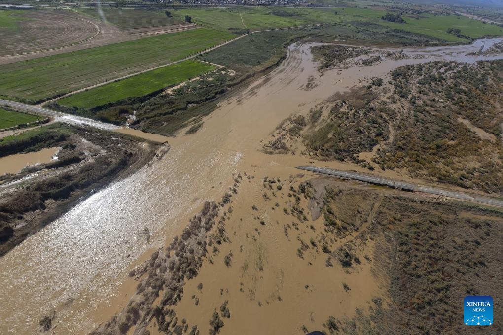 This aerial photo taken on May 9, 2026 shows a road cut off by flooding in Garden Route District Municipality, Western Cape, South Africa. The South African government has officially classified the devastating severe weather affecting multiple provinces across the country as a national disaster. In a statement issued on Saturday night, the Department of Cooperative Governance (DCoG) said that since May 4, heavy rainfall, flooding, thunderstorms, damaging winds and snowfall have caused deaths, infrastructure damage and disruptions to essential services in the Western Cape, Eastern Cape, Northern Cape, North West, Free State and Mpumalanga provinces. (Photo: Xinhua)