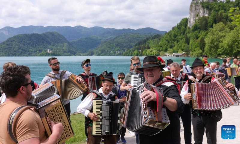 Participants play the accordion during the accordion weekend event at Lake Bled in Bled, Slovenia, May 10, 2026. This annual event brings together hundreds of participants for band performances, ensemble shows and an accordion procession.  (Photo: Xinhua)