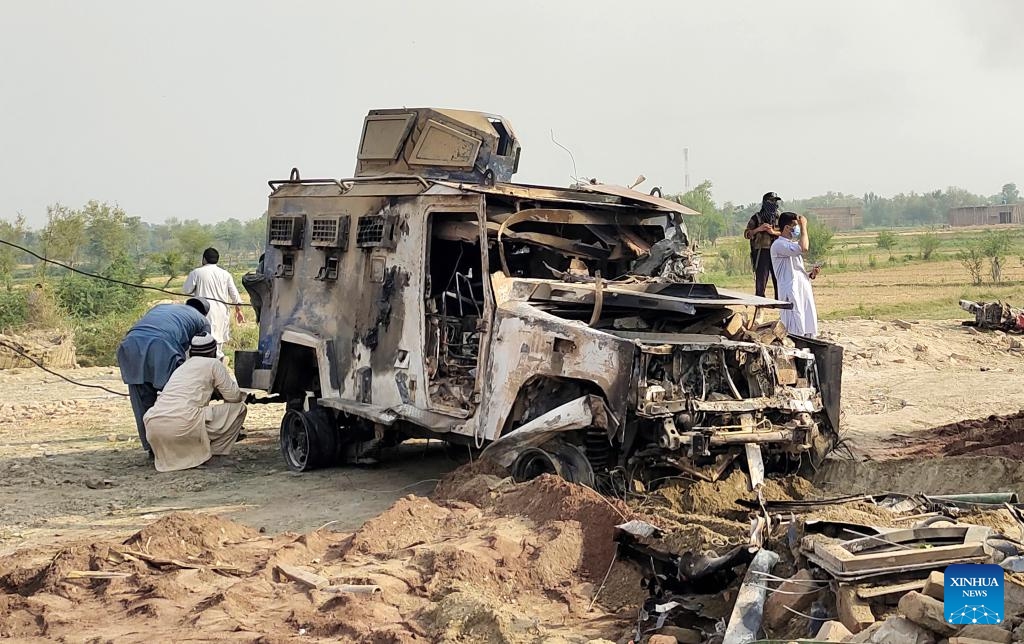 A destroyed police armored vehicle is seen at the site of a suicide attack in Bannu district, Khyber Pakhtunkhwa province, Pakistan, May 10, 2026. At least 12 police personnel were killed and several others injured after a suicide bomber rammed an explosive-laden vehicle into a police installation in Pakistan's northwestern Khyber Pakhtunkhwa province, official sources said on Sunday. (Photo: Xinhua)