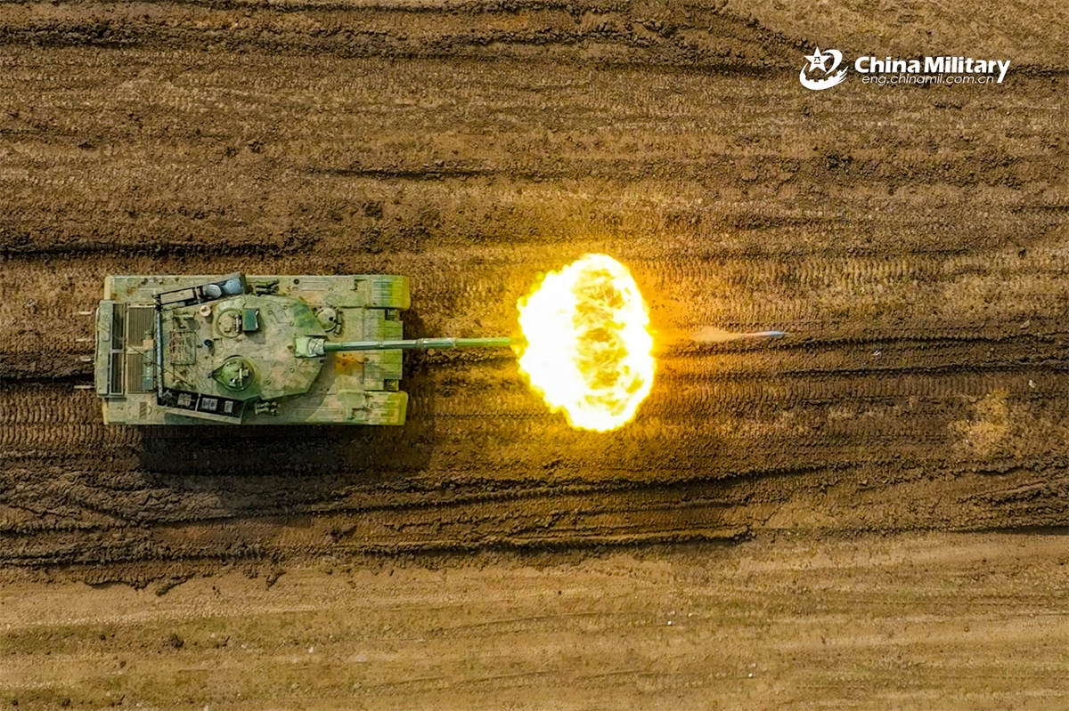 A Type-96 main battle tank (MBT) attached to a brigade under the Chinese PLA 71st Group Army opens fire at the mock target during a live-fire shooting training exercise on April 25, 2026. (Photo: eng.chinamil.com.cn)