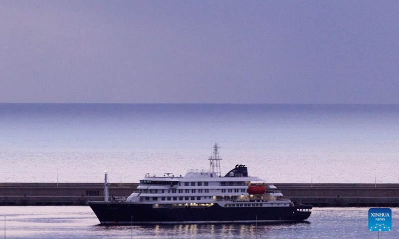 This photo taken on May 10, 2026 shows the hantavirus-hit cruise ship MV Hondius at the Port of Granadilla on the island of Tenerife in Spain. Spanish authorities launched an operation on Sunday to evacuate and transfer all passengers and part of the crew aboard the hantavirus-hit cruise ship MV Hondius. Earlier, the vessel anchored off the Port of Granadilla on the Spanish island of Tenerife. The operation is expected to continue through Sunday and Monday. (Photo: Xinhua)