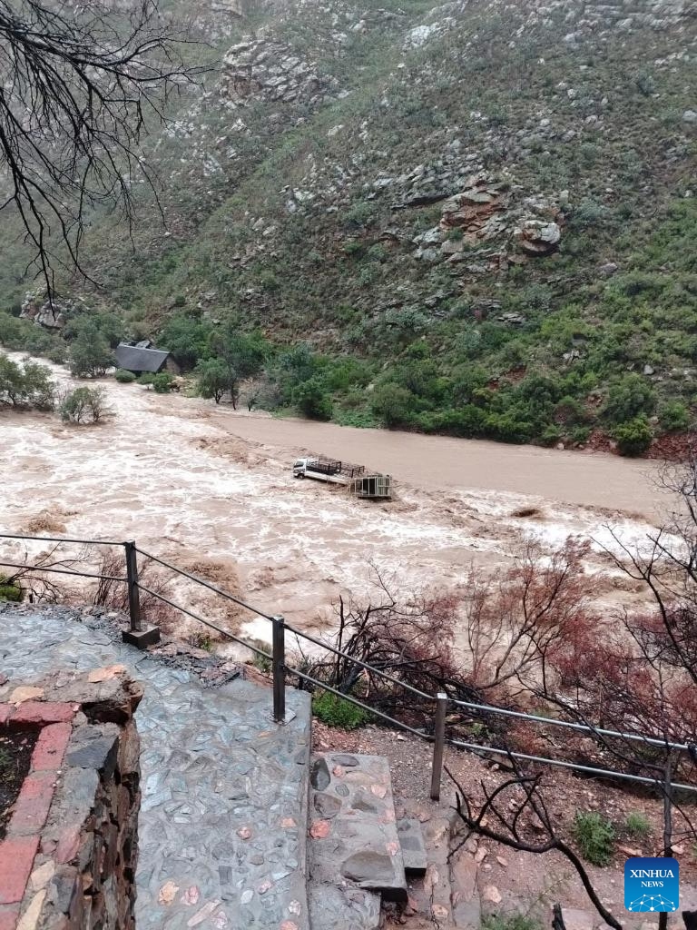 This aerial photo taken on May 9, 2026 shows a road blocked by rocks following a landslide triggered by severe weather in Garden Route District Municipality, Western Cape, South Africa. The South African government has officially classified the devastating severe weather affecting multiple provinces across the country as a national disaster. (Photo: Xinhua)