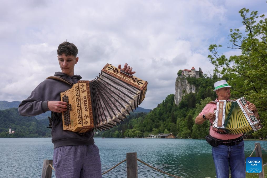 Participants play the accordion during the accordion weekend event at Lake Bled in Bled, Slovenia, May 10, 2026. This annual event brings together hundreds of participants for band performances, ensemble shows and an accordion procession. (Photo: Xinhua)