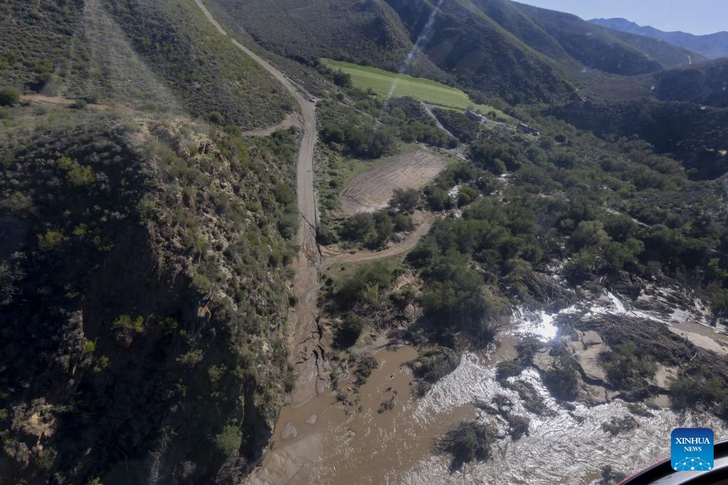This aerial photo taken on May 9, 2026 shows workers repairing a bridge damaged by flooding in Garden Route District Municipality, Western Cape, South Africa. The South African government has officially classified the devastating severe weather affecting multiple provinces across the country as a national disaster. (Photo: Xinhua)