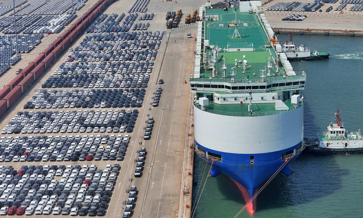 Automobiles are being loaded to a vehicle carrier on May 11, 2026 at the port of Qingdao, East China's Shandong Province. Data shows China's automobile exports reached 901,000 units in April, up 3 percent month-on-month and 74.4 percent year-on-year. Photo: VCG