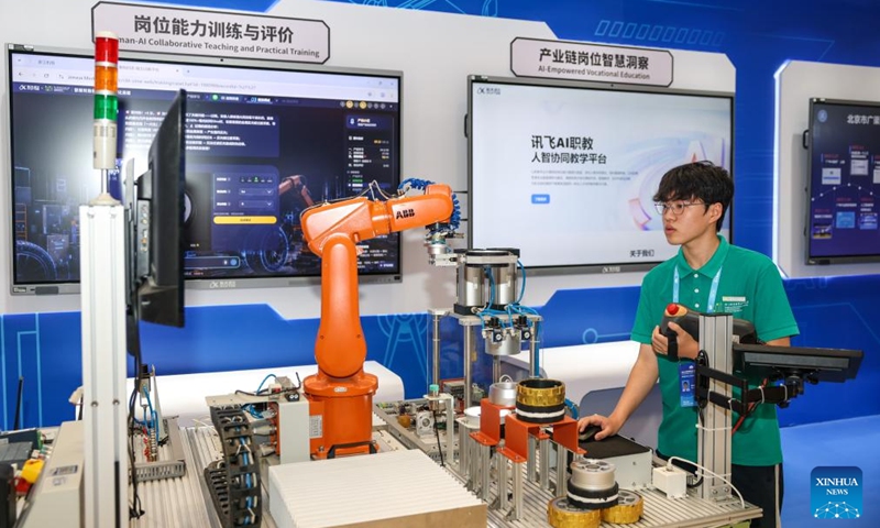 A student from Zhejiang Polytechnic University of Mechanical and Electrical Engineering demonstrates an AI educational platform developed by Chinese AI company iFLYTEK at an exhibition on achievements of global digital education held during the 2026 World Digital Education Conference in Hangzhou, east China's Zhejiang Province, May 11, 2026.